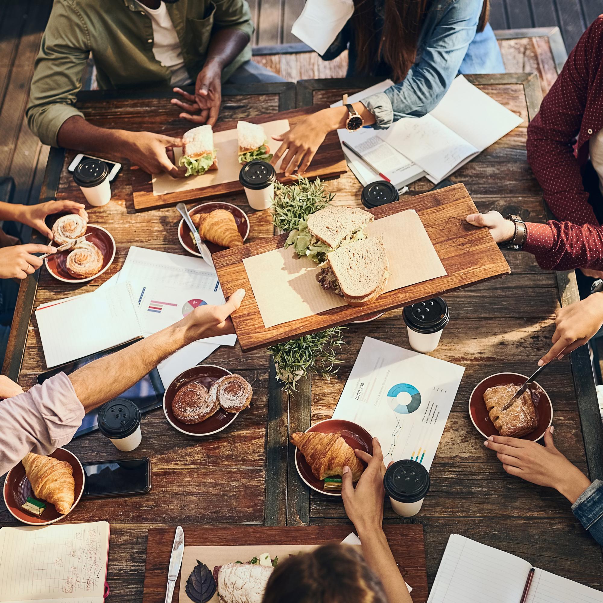 Team tasting session around a wooden table